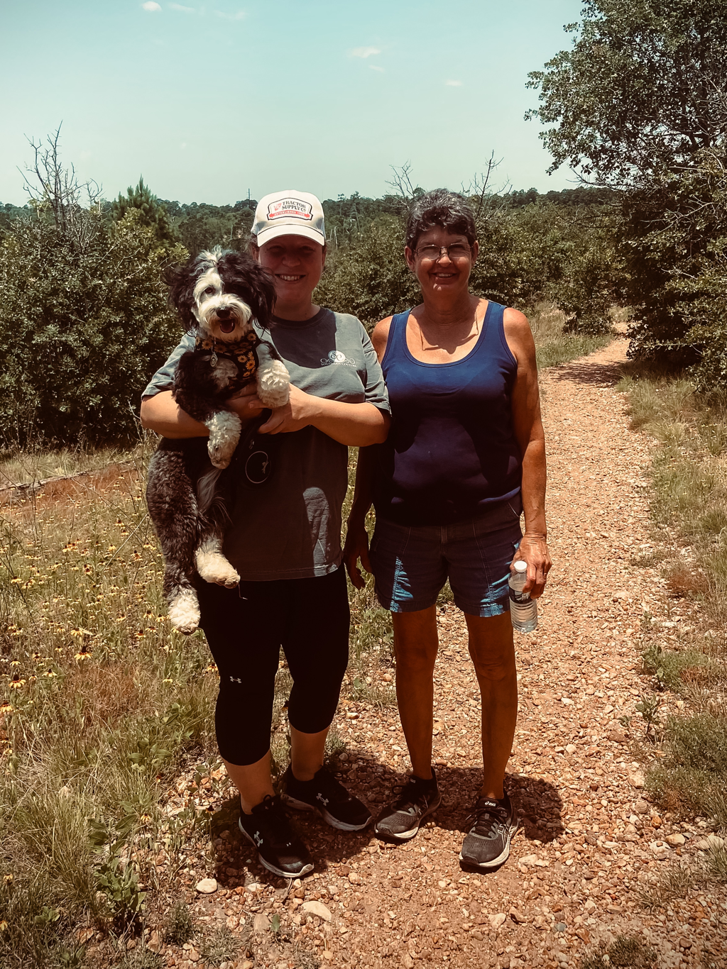 Valerie and Tracy on their farm with one of their doodles